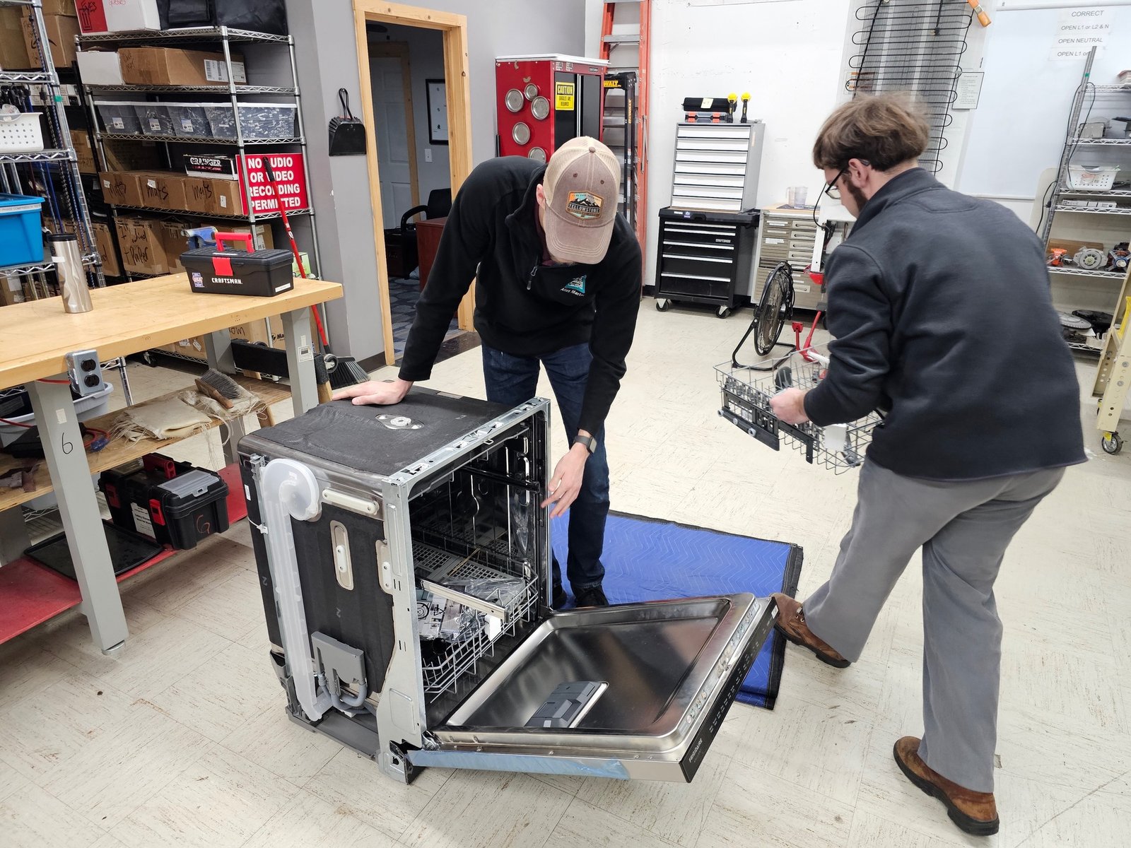 Elite Home Appliance Repair technician repairing a dishwasher in Dubai